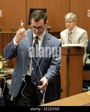 Defense Attorney Ed Chernoff holds up evidence the jury during the ...