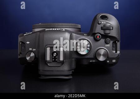 St. Petersburg, Russia - January 9, 2021: On mirrorless camera Canon EOS R6 rear top-plate dial is used to set the ISO. Stock Photo