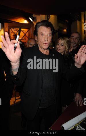 Audrey Dana and Johnny Hallyday meets fans after the last representation of 'Le Paradis Sur Terre' held in the Edouard 7 theatre in Paris, France, on november 19,2011.Photo by Alban Wyters/ABACAPRESS.COM Stock Photo