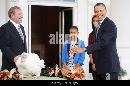 US President Barack Obama pardons 'Liberty' the National Thanksgiving Turkey in a ceremony in the North Portico of the White House in Washington, D.C., USA on November 23, 2011. The President is joined by his daughters Sasha and Malia and Richard Huisinga Willmar Poultry Company. Photo by Olivier Douliery/ABACAPRESS.COM Stock Photo