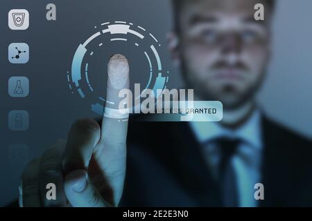 Young man logging into electronic patient account. Innovative technologies in medicine Stock Photo