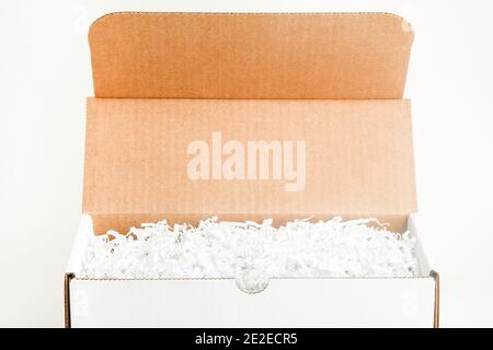 An open white rectangular cardboard packaging box set on plain white background. Stock Photo