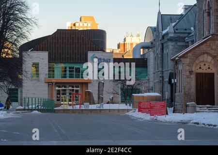 Ottawa, Ontario, Canada - January 8, 2021: The Elgin Street entrance to Ottawa City Hall, where the parking garage ramp leads to registration for driv Stock Photo