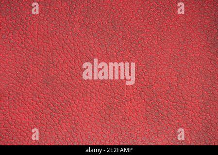 Dark-burgundy genuine leather with a characteristic pattern. Background, pattern, texture. Stock Photo