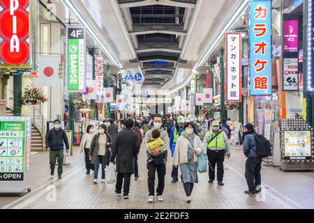 Kawasaki, Japan. 13th Jan, 2021. Pedestrians with face masks walk on Ginryugai street in Kawasaki. Credit: SOPA Images Limited/Alamy Live News Stock Photo