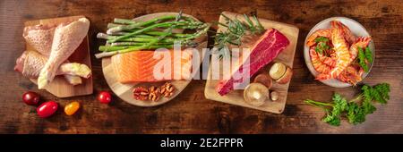 Main proteins, shot from the top on a dark rustic wooden background, the concept of a balanced diet Stock Photo