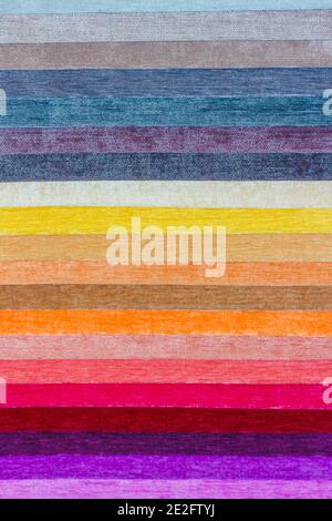Samples of colored fabric with a brightly expressed rough texture. Vertical photography Stock Photo