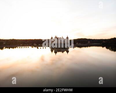 Panorama sunset reflection of Schloss Moritzburg baroque castle on Schlossteich lake island in Saxony Germany in Europe Stock Photo
