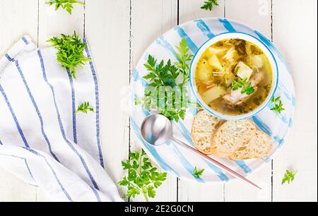 Chicken soup with noodles and vegetables in bowl. Top view, overhead, copy space Stock Photo
