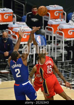 Los Angeles, United States. 13th Jan, 2021. Los Angeles Clippers' forward Kawhi Leonard scores over New Orleans' guard Sindarius Thornwell during the fourth quarter at Staples Center in Los Angeles on Wednesday, January 13, 2021. The Clippers defeated the short-handed Pelicans 111-106. Photo by Jim Ruymen/UPI Credit: UPI/Alamy Live News Stock Photo