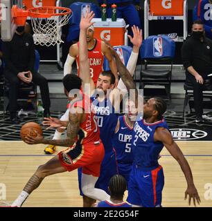 Los Angeles, United States. 13th Jan, 2021. New Orleans' guard Nickel Alexander-Walker passes to the corner past Los Angeles Clippers' defenders during the fourth quarter at Staples Center in Los Angeles on Wednesday, January 13, 2021. The Clippers defeated the short-handed Pelicans 111-106. Photo by Jim Ruymen/UPI Credit: UPI/Alamy Live News Stock Photo