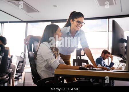 Startup business people group of programmer working as team to find solution to problem Stock Photo