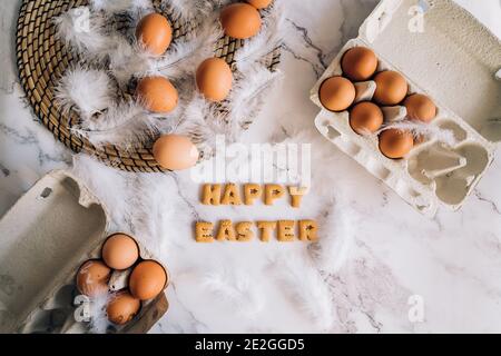 Creative bright composition with festive atmosphere. Easter holiday decorations on marble background. Stock Photo