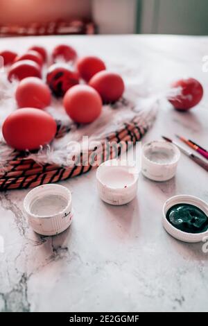 Pastel pink Easter Eggs. brushes, paints on marble background Stock Photo