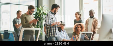 Dream team in middle of working day at the office Stock Photo