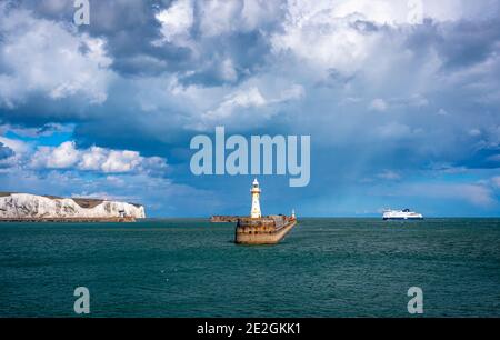 An incoming ferry into the Port of Dover with the White Cliffs seen in the background. Dover, Kent Stock Photo