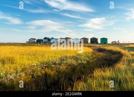 Beach huts on the North Kent coast at Seasalter, Whitstable, Kent. Stock Photo