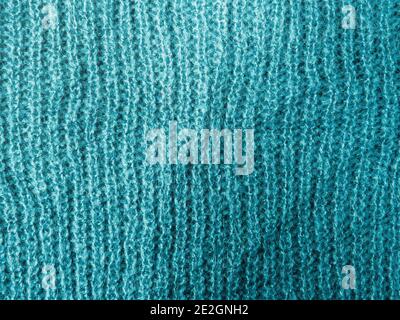 Turquoise wool knitted sweater texture background Stock Photo