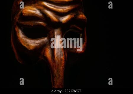 Close up Carnival mask venice Pantalone isolated on black Stock Photo
