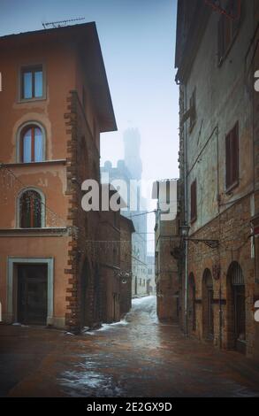 Volterra old town during a snowfall in winter. Pisa province, Tuscany, Italy, Europe. Stock Photo
