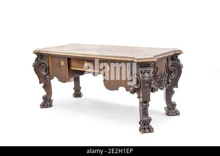 Old smart brown writing desk with drawers on the white background. Stock Photo