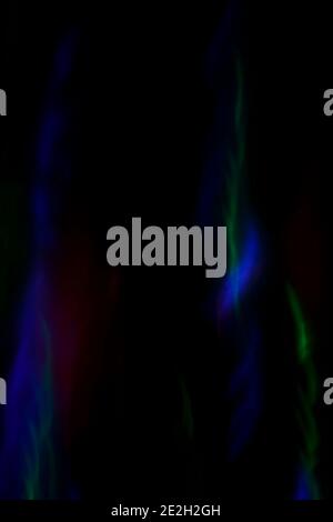 Abstract photo of blurred motion and colorful lights at dark. Abstract high resolution background. Copy space. Stock Photo