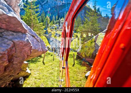 View of Mount Pilatus descent from worlds steepest cogwheel railway Pilatusbahn, tourist landscape of Switzerland Stock Photo