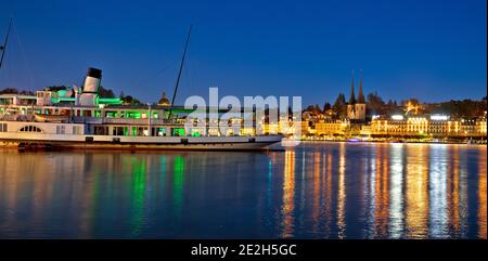 Town of Luzern evening waterfront and boat on Swiss lake Luzern view, central Switzerland Stock Photo