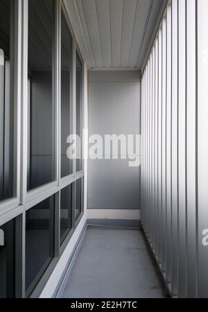 Small balcony near the conference room with the metal fence, modern office building in the city of Thailand. Stock Photo