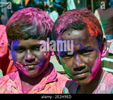 Kalna, West Bengal, India. Typical atmosphere in the city on the occasion of the Holi festival, when the young and the old are splashing with colored Stock Photo