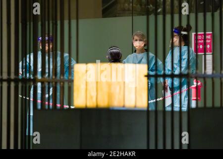 January 14, 2021: Quarantine staff wait for the arrival of tennis players at the Grand Hyatt hotel in Melbourne ahead of the 2021 Australian Open tennis tournament. Players have to quarantine for 14 days and are tested every day before being permitted to compete. 15 charter flights will transport 1200 players and officials to the tournament. Sydney Low/Cal Sport Media Stock Photo