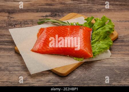 Salted Salmon piece steak served rosemary Stock Photo