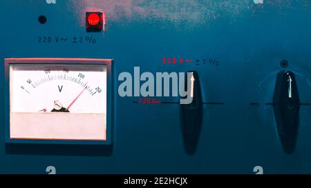 Electrical panel surface . Voltmeter and toggle switches Stock Photo