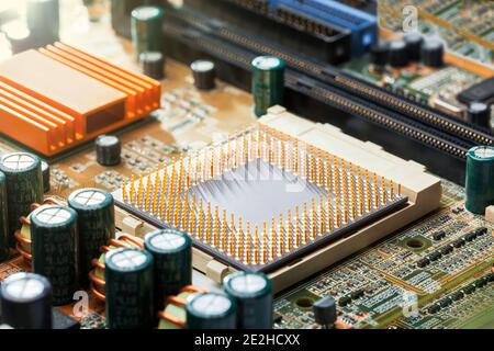 cpu with legs on the motherboard socket, chip upgrade closeup, nobody. Stock Photo
