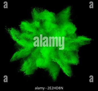 green holi paint color powder explosion isolated on dark black background. industry beautiful party festival concept