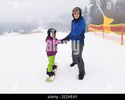 snowboard lesson in winter resort Stock Photo