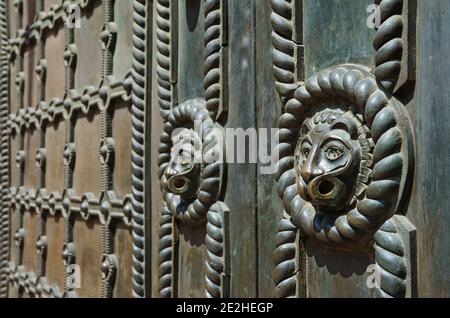 Bronze surface decoration with lions and grid on Golden Gate entrance door in Kyiv, Ukraine Stock Photo
