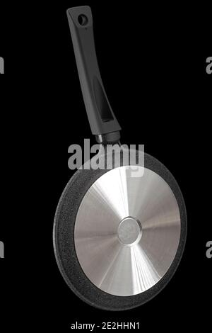 Grey frying pan with non-stick, rear view, isolated on black background Stock Photo