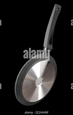 Grey frying pan with non-stick, rear view, isolated on black background Stock Photo