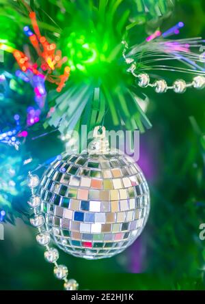 Shiny Christmas ball and decorations hanging on a Christmas tree Stock Photo