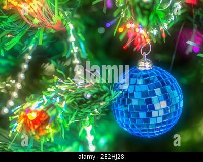 Shiny Christmas ball and decorations hanging on a Christmas tree Stock Photo