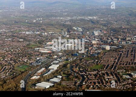 aerial view of the M60 looking east towards Stockport in Greater Manchester with the Pennines in the far distance Stock Photo