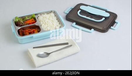 Tiffin carrier with food isolated on white background Stock Photo