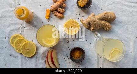 Various immune boosting citrus drinks with apples, ginger and turmeric Stock Photo