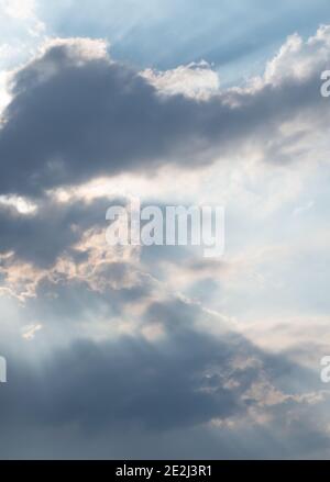 Concept: Hope, a cloudy sky with rays of sunlight breaking through Stock Photo