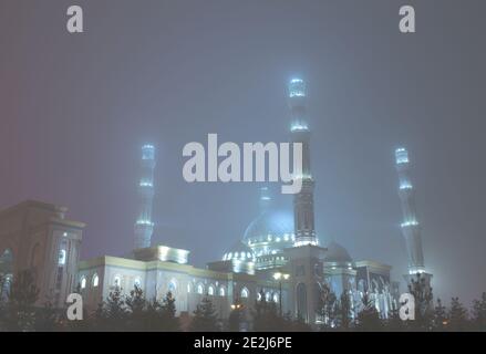 Night mosque in the haze weather. Stock Photo