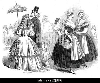 Sketch in Cologne, 1845. A family, and two women, Germany. '...the lady has on a morning bonnet, with a long &quot;curtain,' and a sort of polka pelisse; such as are worn in the country: the fashion is seen, in miniature, in the child's dress. The hat of the gentleman is of unmistakeable Continental magnitude'. The second group shows 'women of the middle class'. From &quot;Illustrated London News&quot;, 1845, Vol VII. Stock Photo