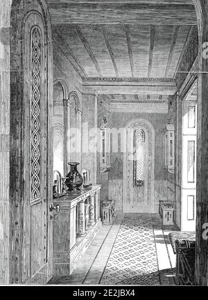 The Vestibule, Lansdown Tower, 1845. Interior of an architectural folly built for British art collector William Beckford near Bath, Somerset. It was designed by Henry Goodridge. The house and contents were auctioned after Beckford's death in 1844. 'The Vestibule...is small; but lit by painted windows, and sumptuously fitted. The colours are crimson and dark oak. Here are four Roman seats, of Riga and Pollard oak, with bold lion masks, and deep paneling - of the highest design and most elaborate workmanship. There are likewise four franging oak cabinets. The costly items are Etruscan vases, Ind Stock Photo