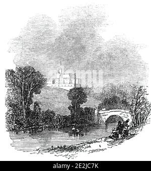 Lambton Castle, 1844. View of the the ancestral seat of the Lambton family, the Earls of Durham, near Chester-le-Street, County Durham. It was built between 1820 and 1828 around Harraton Hall, a 17th-century mansion, by John Lambton, first Earl of Durham and one-time Governor General of Canada. The castle was designed by architects Joseph Bonomi the Elder and his son Ignatius and built in the style of a Norman castle. 'It stands on the north bank of the river Wear, and occupies the site of Harraton Hall, formerly the residence of the D'Arcys and Hedworths'. From &quot;Illustrated London News&q Stock Photo