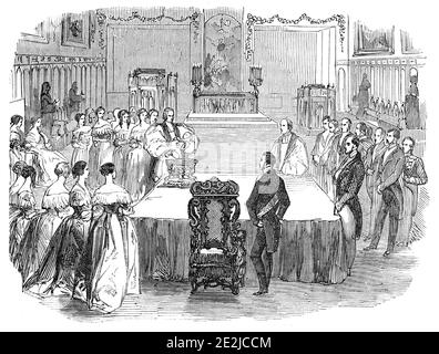 The Christening in the Chapel, 1844. 'The ceremony of christening the infant daughter of the Marquis and Marchioness of Exeter...was performed by the Bishop of Peterborough...Her Majesty [Queen Victoria] attended at the ceremony, and occupied the seat in which it is stated Queen Elizabeth usually sat, when attending divine service at Burghley [House]. The infant was named after her Most Gracious Majesty. The Queen appeared to be very much interested in the ceremony. After it had concluded, her Majesty kissed the young godchild of her Royal Consort...When brought into the chapel the infant was Stock Photo
